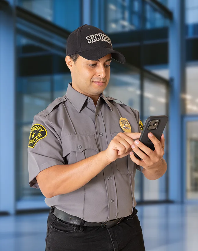Security officer checking in on a mobile phone.
