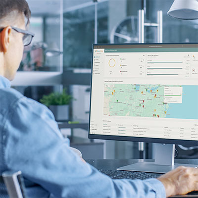 Man working at a computer looking at Securitime software.