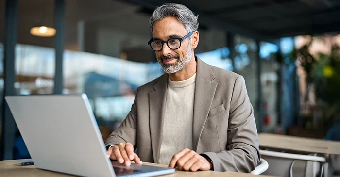 Man working on a laptop.