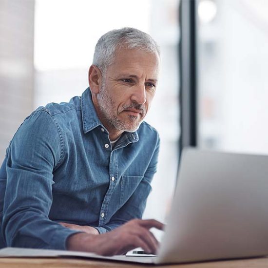 Man working on a laptop.